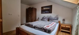 a bedroom with a bed in a room at Time Out Moments Haus mit eigener Sauna in Grafenau