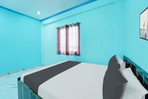 Ένα ή περισσότερα κρεβάτια σε δωμάτιο στο Super Hotel O R K Marriage Hall and Guest House