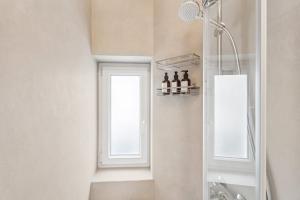 a bathroom with a shower and a window at SHINY HOMES - Modern & Cozy Stay in Bielefeld Mitte in Bielefeld +30 photos