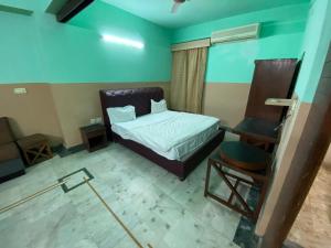 Ένα ή περισσότερα κρεβάτια σε δωμάτιο στο Hotel Blue Bird +13 φωτογραφίες