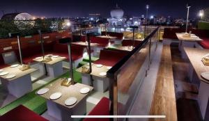 a room with tables and toilets on a roof at Hotel Blue Bird in Jaipur +13 photos