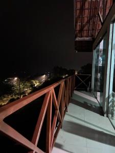 a balcony of a house at night at Gravata Paradise in Gravatá +112 photos