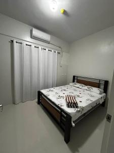 a bedroom with a bed in a room at Azure Edge in Dauis +39 photos