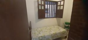 Postel nebo postele na pokoji v ubytování Casa a 20 metros da praia, simples com ótimo custo benefício - Mucuri, Ba