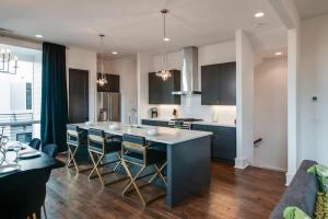 a kitchen with a large island in the middle at Luxury Condo - The Gulch - Private Rooftop in Nashville