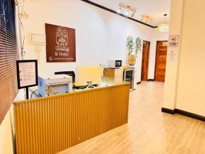 a dental office with a yellow counter in a room at Demi Cafe and Hostel in Vientiane +78 photos