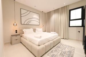 Postel nebo postele na pokoji v ubytování Mostdaf S7