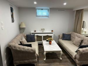 a living room with two couches and a table at Appartement in Oberschaeffolsheim +1 photo