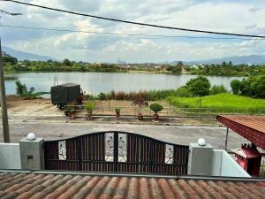 a view of a lake from a house at Leaf Haven Homestay in Ipoh +5 photos
