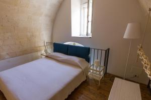 Postel nebo postele na pokoji v ubytování Casamata Matera