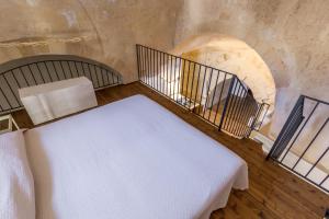 Postel nebo postele na pokoji v ubytování Casamata Matera