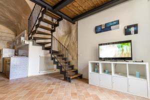 TV a/nebo společenská místnost v ubytování Casamata Matera