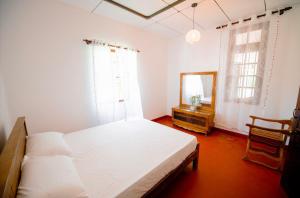 Ένα ή περισσότερα κρεβάτια σε δωμάτιο στο Aurora පාට පාට