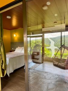 Postel nebo postele na pokoji v ubytování Rainbow Valley Lodge Costa Rica