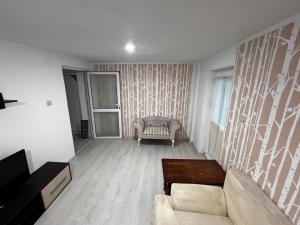 Posezení v ubytování Cozy Loft Craiova 1