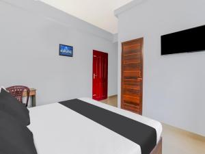 Μια τηλεόραση ή/και κέντρο ψυχαγωγίας στο Hotel O NILA TOURIST HOME +23 φωτογραφίες