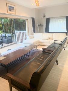 a living room with a couch and a table at ISU BASE - Vacation STAY 12851 in Shima