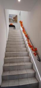 a stairway with a bunch of flowers on it at Cichy Zaułek 9A in Brodnica