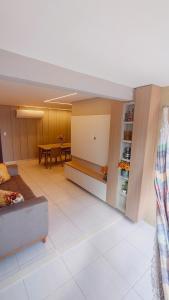 a living room with a couch and a table at Apartamento Aconchegante e completo em Manaíra in João Pessoa