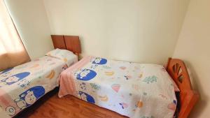 Ένα ή περισσότερα κρεβάτια σε δωμάτιο στο 11-3 Depto amoblado y equipado a pasos de la playa Arica!!