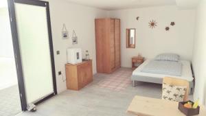 a bedroom with a bed and a tv in it at Casa Calma in Las Breñas