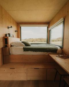 Postel nebo postele na pokoji v ubytování Parcel Tiny House Ty Pois 2 près de la Pointe de La Torche