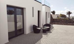 two toilets sitting on the side of a building at Casa Calma in Las Breñas +19 photos