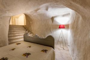 Postel nebo postele na pokoji v ubytování Casamata Matera