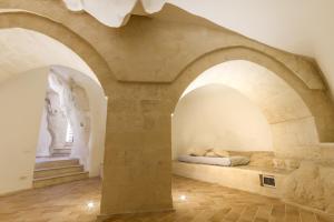 Postel nebo postele na pokoji v ubytování Casamata Matera