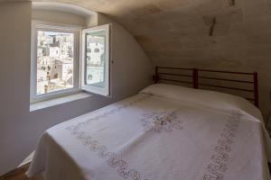 Postel nebo postele na pokoji v ubytování Casamata Matera
