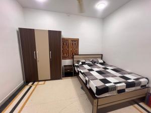 a bedroom with a bed in a room at DNN Brothers Villa in Jaffna