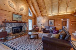 a living room with a fireplace in a cabin at Atop Boone in Boone