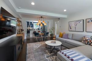 a living room with a couch and a table at Harmony House in Nashville