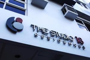 a sign on the side of a building at The Studio 18 Residences in Manila