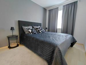 Postel nebo postele na pokoji v ubytování Rovaniemi apartment with private sauna & free parking