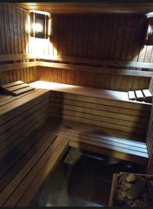 a inside of a sauna with a bench in it at Aspen Luxury Apartamnet in Razlog
