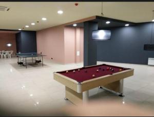 a pool table with balls on it in a room at Aspen Luxury Apartament in Razlog +23 photos