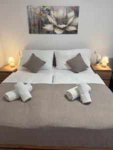 Ένα ή περισσότερα κρεβάτια σε δωμάτιο στο Magnet Apartment