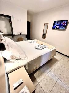 a hospital room with a bed and a tv at Pousada La Riviera - Pé na areia e Passeios em Maragogi in Maragogi +91 photos