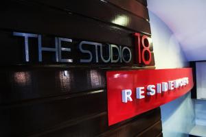 a sign that reads the studio restrooms at The Studio 18 Residences in Manila