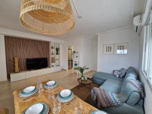 a living room with a couch and a table at Casa de la Suerte in San Fulgencio