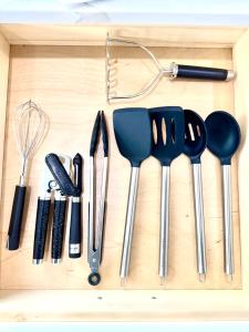 a drawer with a bunch of kitchen utensils on it at Newly Built Lake House Near NYC EWR MetLife AD Mall in Passaic