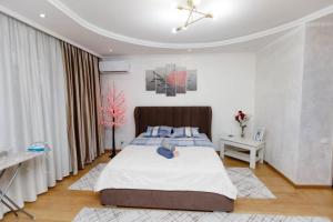 Ένα ή περισσότερα κρεβάτια σε δωμάτιο στο Уалих159