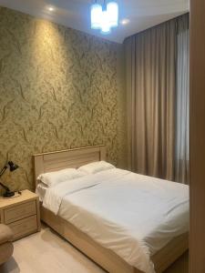 Ένα ή περισσότερα κρεβάτια σε δωμάτιο στο Tbilisi Cultural Center