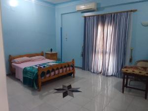 En eller flere senge i et værelse på Memnon Apartments + 33 billeder