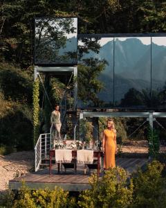 a man and a woman standing in front of a table at Spino Fiorito Stay in Casola in Lunigiana