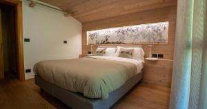 Postel nebo postele na pokoji v ubytování Albergo Riglarhaus