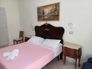 Postel nebo postele na pokoji v ubytování Aparthotel Napoli Railway