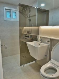 a bathroom with a sink and a toilet at LIKE Mangwon in Seoul