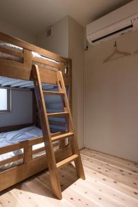 Postel nebo postele na pokoji v ubytování Shizuya KYOTO